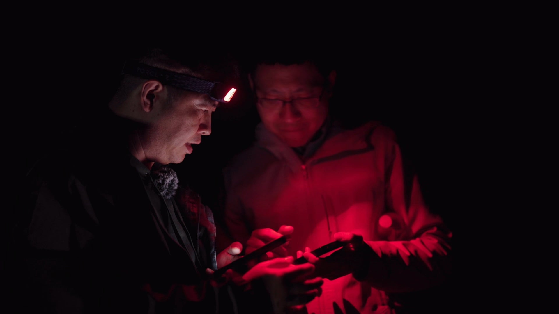 Song Chen and Dr. Shen testing equipment at night in Death Valley